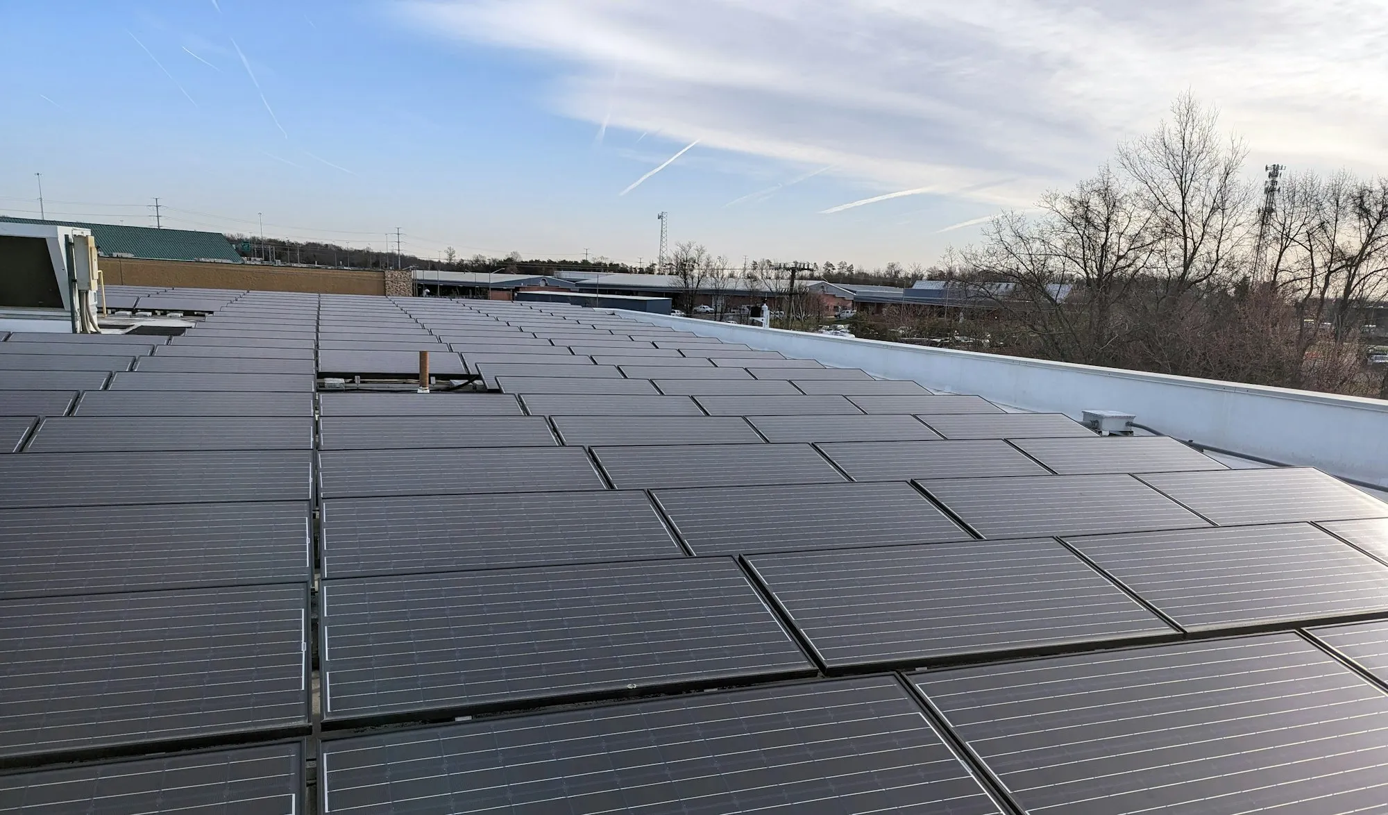 Solar panels covering the flat roof of a commercial building